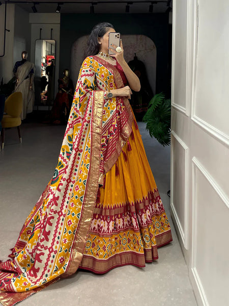 Mustard Color Ikkat Patola Print With Foil Work Tussar Silk Lehenga Choli