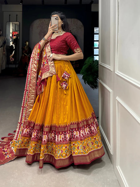 Mustard Color Ikkat Patola Print With Foil Work Tussar Silk Lehenga Choli