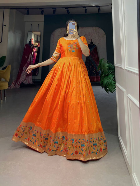 Presenting Orange color Designer Jacquard Silk Gown