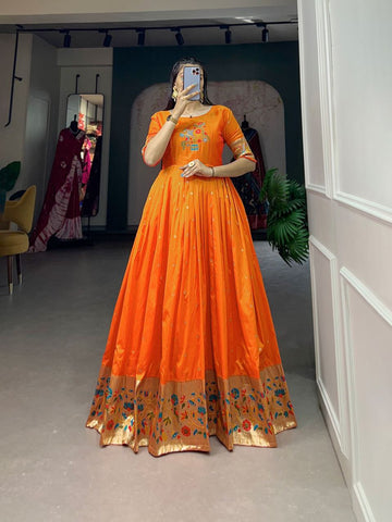 Presenting Orange color Designer Jacquard Silk Gown